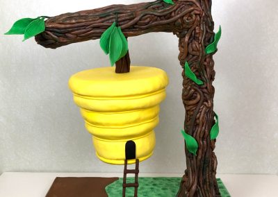 Beehive hanging from tree birthday cake by Fancy Pants Cakes