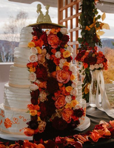 vegan 5-tier split wedding cake filled with flowers