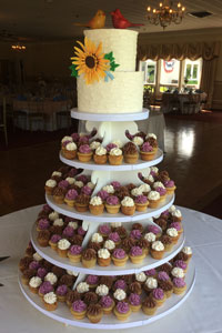 2-tier cake on top of cupcake stand