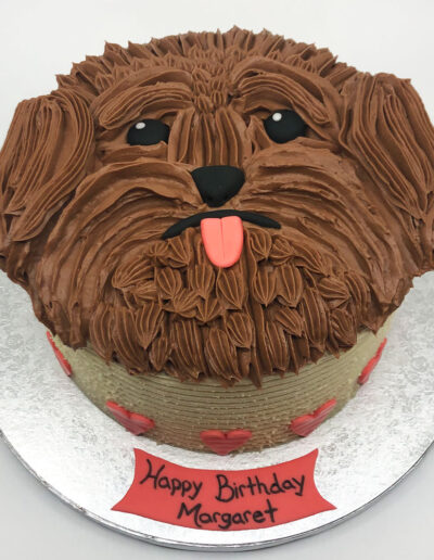 buttercream dog face birthday cake