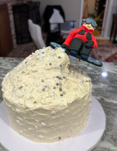 winter birthday cake with custom fondant snowboarder by Fancy Pants Cakes